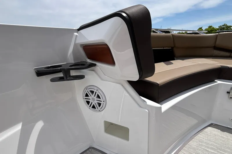 Slide: The Image of 2026 Monterey Elite 27 OB boat interior with cup holders and speaker. - 37