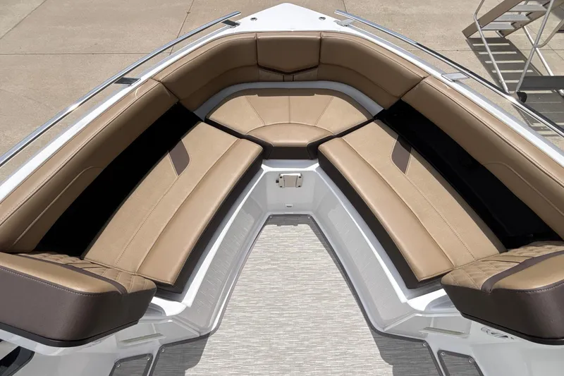 Slide: The Image of Luxurious seating area on 2026 Monterey Elite 27 OB boat, featuring tan leather upholstery. - 38