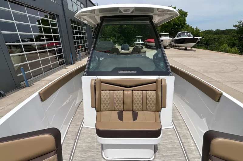 Slide: The Image of 2026 Monterey Elite 27 OB boat with luxurious seating and modern design. - 39