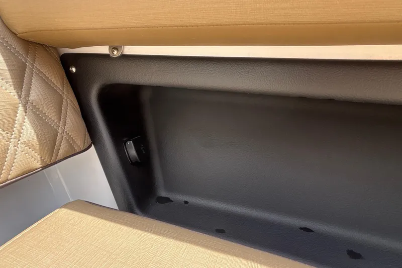Slide: The Image of Interior storage compartment of 2026 Monterey Elite 27 OB boat with beige upholstery. - 42