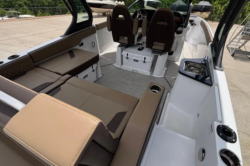 Slide: The Image of Interior of 2026 Monterey Elite 27 OB boat with luxurious seating and modern amenities. - 6