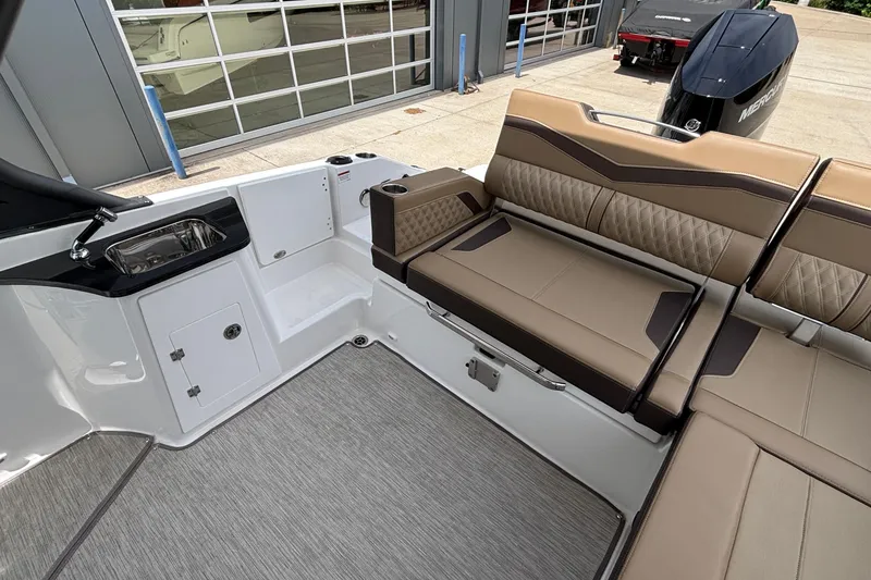 Slide: The Image of Interior of 2026 Monterey Elite 27 OB boat with seating and sink. - 7