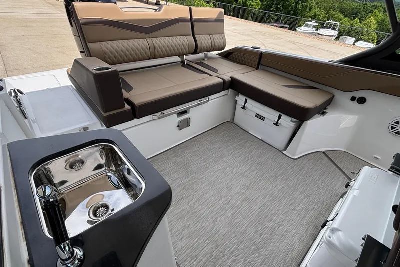 Slide: The Image of Luxurious interior of 2026 Monterey Elite 27 OB boat with seating and sink. - 9
