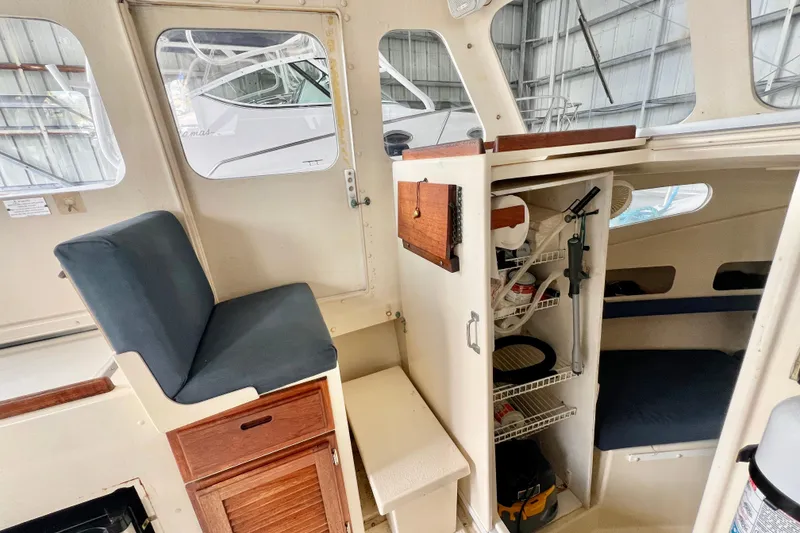 Slide: The Image of Interior of 2001 Rosborough RF-246 Sedan Cruiser with seating and storage compartments. - 12
