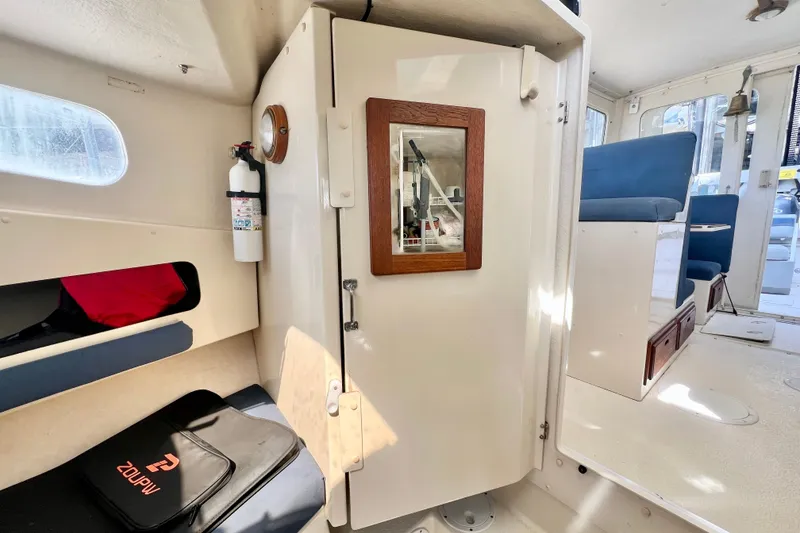 Slide: The Image of Interior of a 2001 Rosborough RF-246 Sedan Cruiser, featuring seating and storage. - 20
