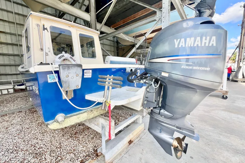 Slide: The Image of 2001 Rosborough RF-246 Sedan Cruiser with Yamaha outboard motor in storage facility. - 5