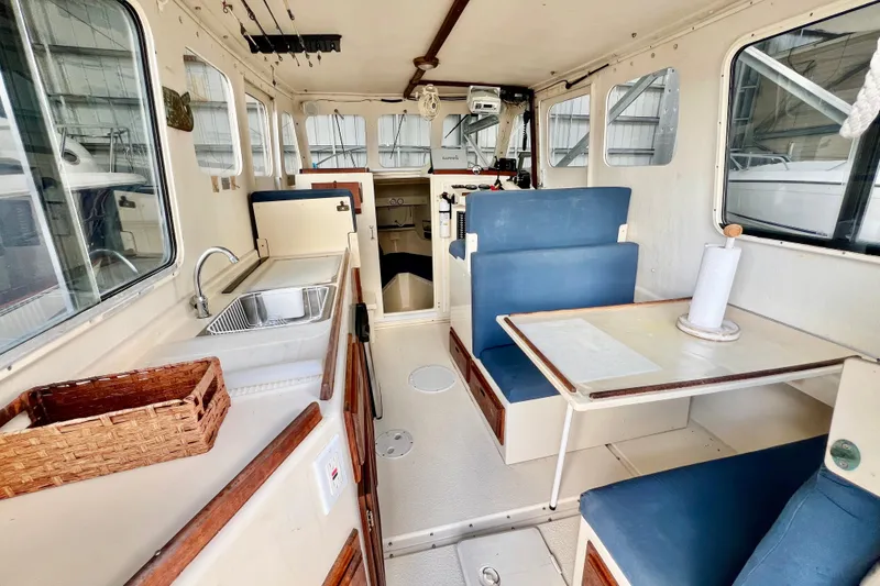 Slide: The Image of 2001 Rosborough RF-246 Sedan Cruiser interior with kitchenette and seating area. - 9