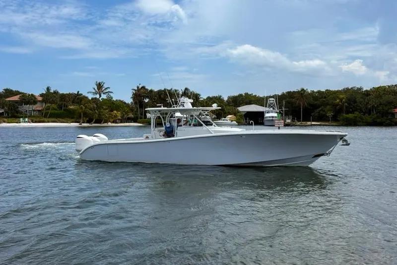 The Image of 2014 Yellowfin 42 Offshore boat cruising on a scenic waterway. - 0