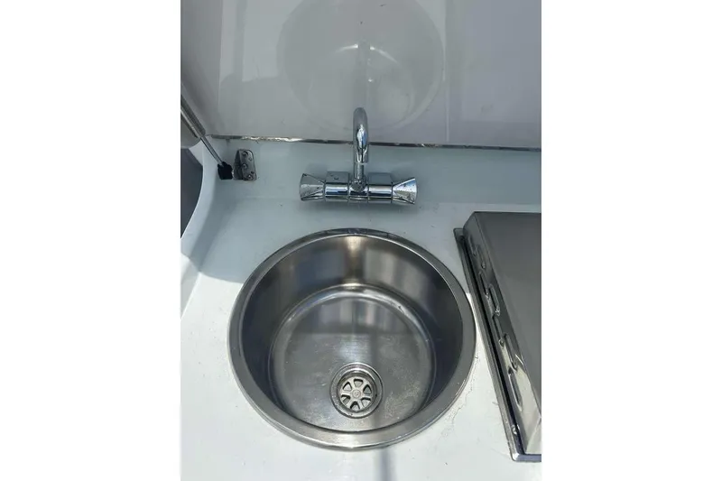 Slide: The Image of Stainless steel sink and faucet on 2014 Yellowfin 42 Offshore boat. - 14