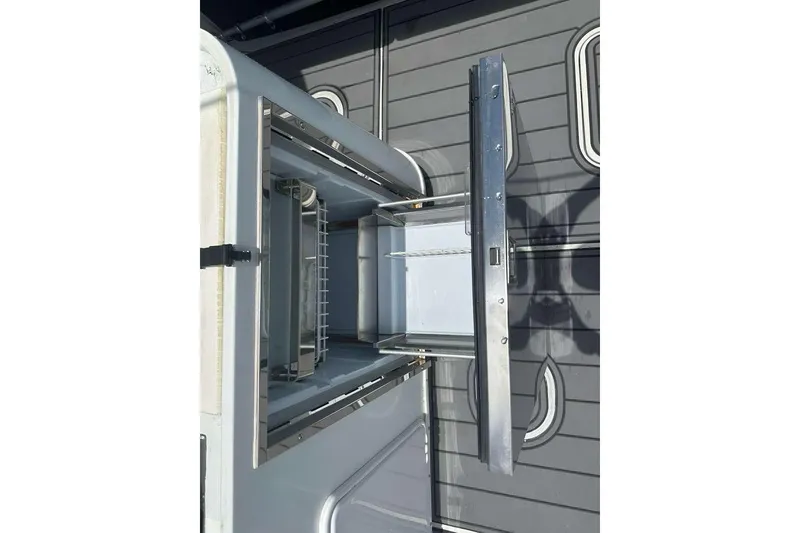Slide: The Image of Open storage compartment on 2014 Yellowfin 42 Offshore boat deck. - 15