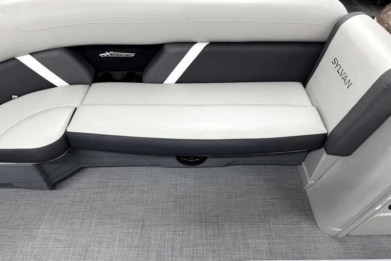 Slide: The Image of 2025 Sylvan Mirage X X5 boat interior with sleek gray seating and modern design. - 12