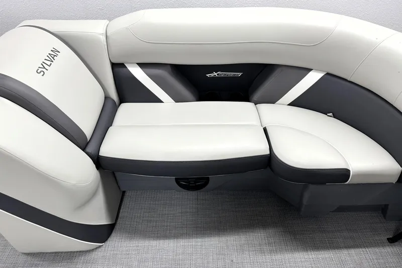 Slide: The Image of 2025 Sylvan Mirage X X5 boat seating with sleek white and gray upholstery. - 13