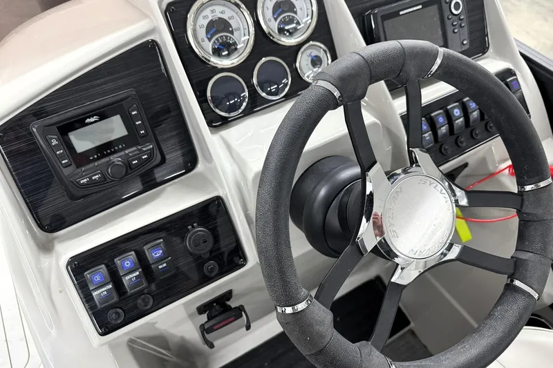 Slide: The Image of 2025 Sylvan Mirage X X5 dashboard with steering wheel, gauges, and control panel. - 21