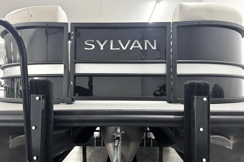 Slide: The Image of 2025 Sylvan Mirage X X5 pontoon boat, sleek black design, showroom display. - 3