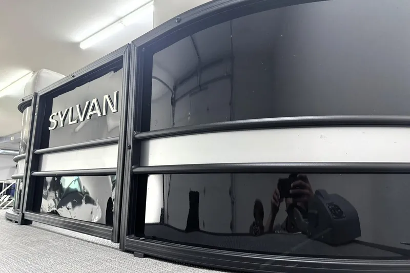 Slide: The Image of 2025 Sylvan Mirage X X5 pontoon boat with sleek black exterior design. - 4