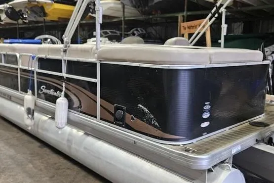 Slide: The Image of 2013 Sweetwater SW 2286 pontoon boat in storage, side view. - 1
