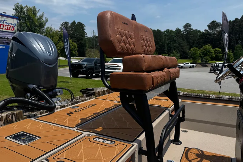Slide: The Image of Avid 207 Recon 2026 boat with cushioned seating and powerful outboard motor. - 12