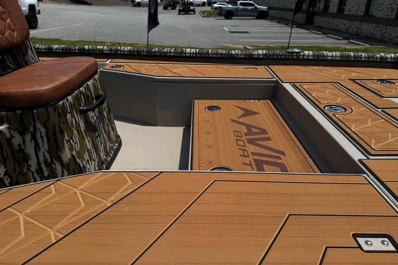 Slide: The Image of Avid 207 Recon 2026 boat interior with custom wood finish and seating. - 16