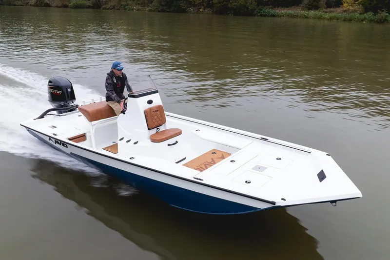 Slide: The Image of Manufacturer Provided Image: Avid 207 Recon 2026 boat cruising on a calm river with a person steering. - 22