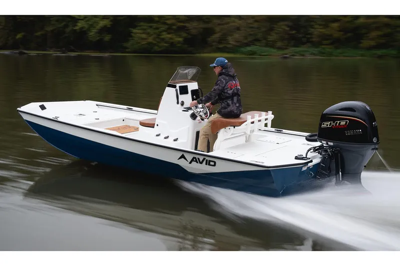 Slide: The Image of Manufacturer Provided Image: Avid 207 Recon 2026 boat cruising on a calm river with a Yamaha engine. - 25