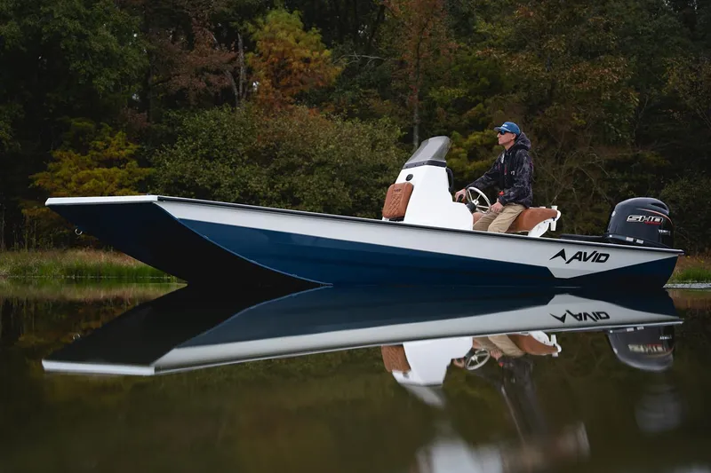 Slide: The Image of Manufacturer Provided Image: Avid 207 Recon 2026 boat on calm water, surrounded by lush greenery. - 26