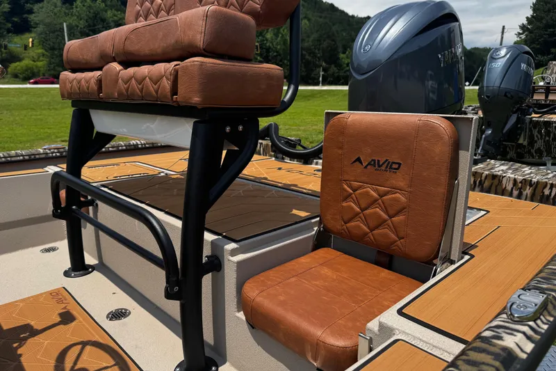Slide: The Image of 2026 Avid 207 Recon boat with brown leather seating and Yamaha engines. - 3