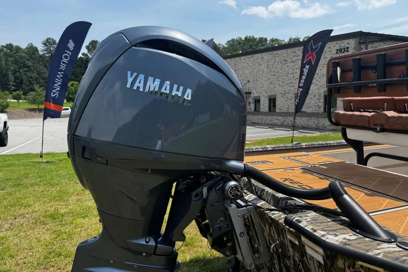 Slide: The Image of Yamaha outboard motor on Avid 207 Recon boat, 2026 model, with dealership flags in background. - 9