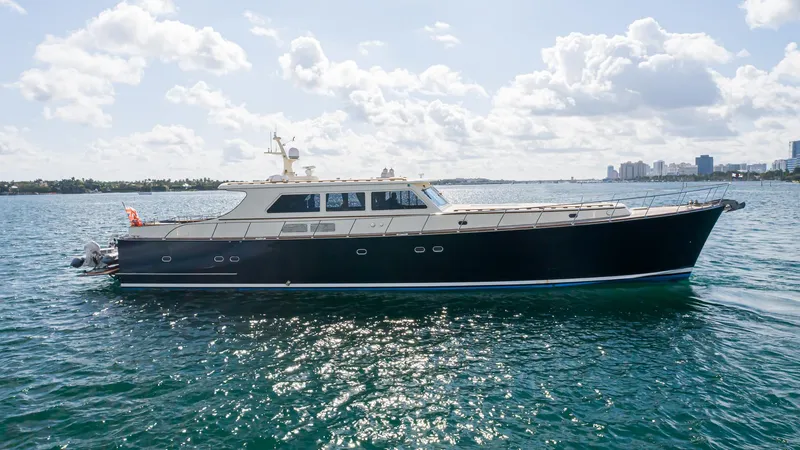 The Image of 2006 Vicem 85 Classic yacht cruising on a sunny day with city skyline in background. - 0