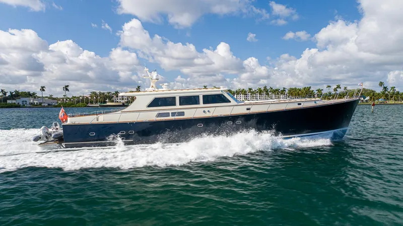 Slide: The Image of 2006 Vicem 85 Classic yacht cruising on blue water under a partly cloudy sky. - 1