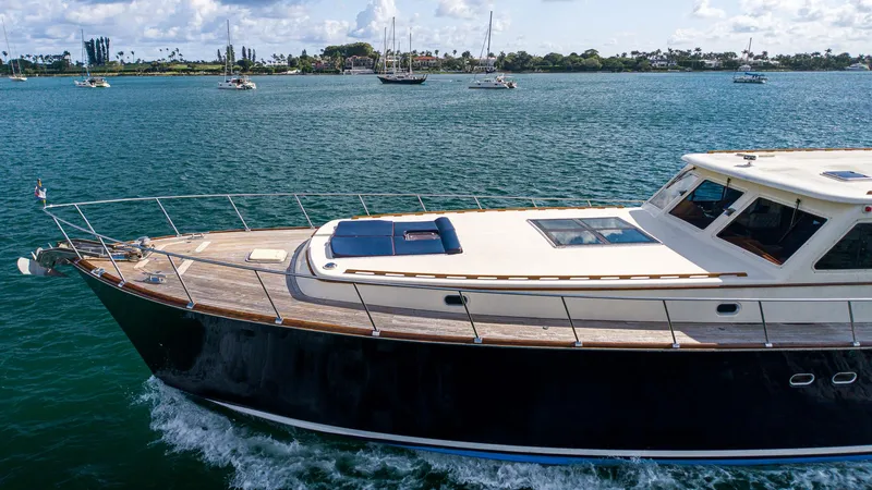Slide: The Image of 2006 Vicem 85 Classic yacht cruising on a sunny day, surrounded by calm waters. - 12