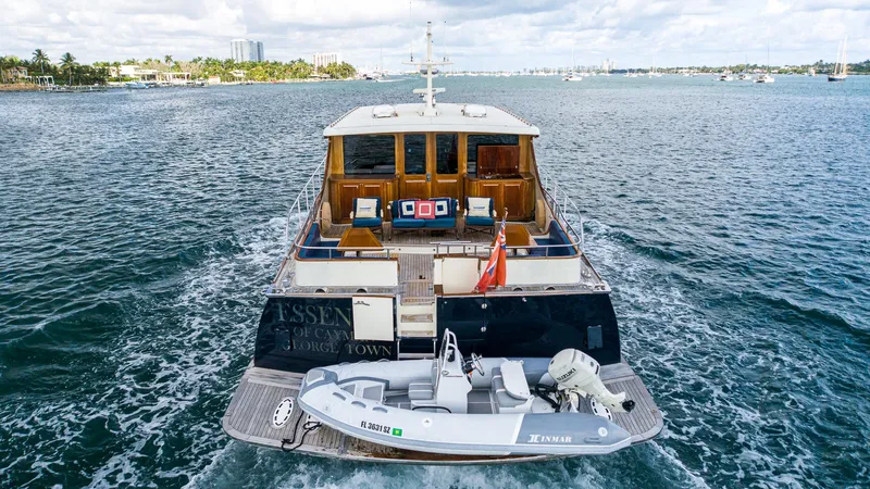 Slide: The Image of 2006 Vicem 85 Classic yacht cruising with tender boat on open water. - 16