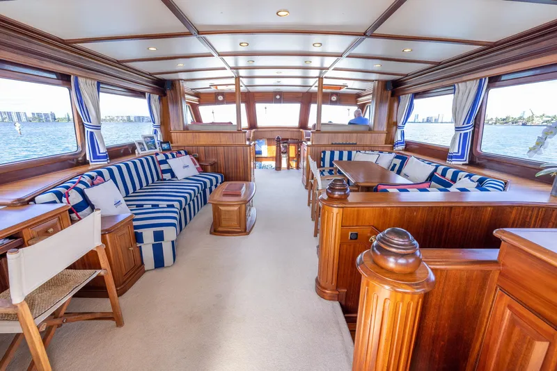Slide: The Image of Luxurious interior of 2006 Vicem 85 Classic yacht with striped seating and wooden finishes. - 22