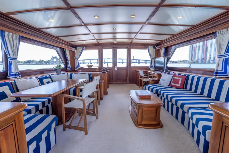 Slide: The Image of Luxurious interior of 2006 Vicem 85 Classic yacht with striped seating and wooden accents. - 23