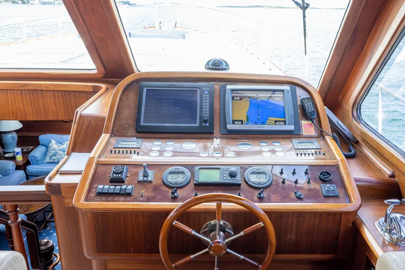 Slide: The Image of 2006 Vicem 85 Classic yacht helm with navigation screens and wooden steering wheel. - 33