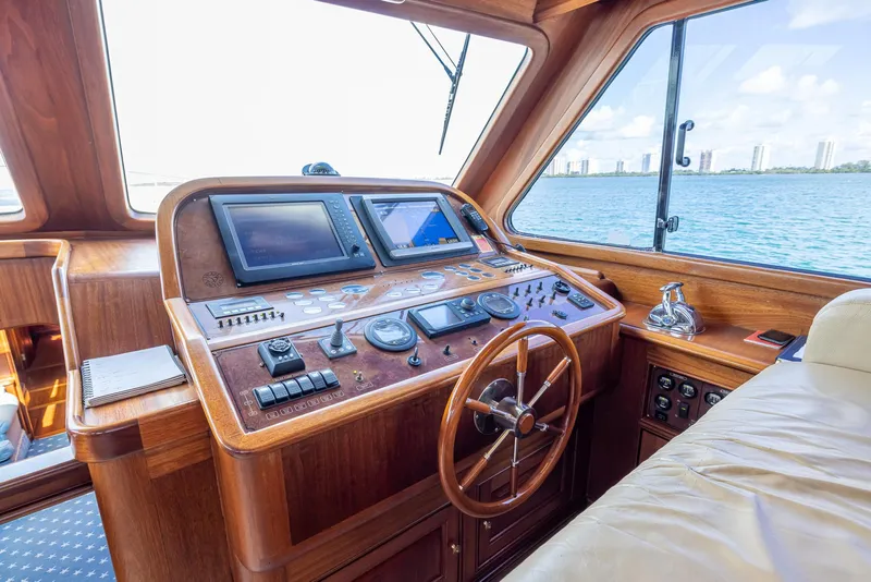 Slide: The Image of Helm of 2006 Vicem 85 Classic yacht with wooden dashboard and navigation equipment. - 34