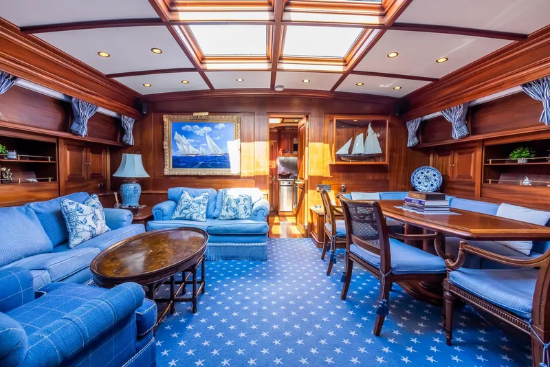 Slide: The Image of Luxurious interior of 2006 Vicem 85 Classic yacht with elegant wood paneling and blue furnishings. - 35