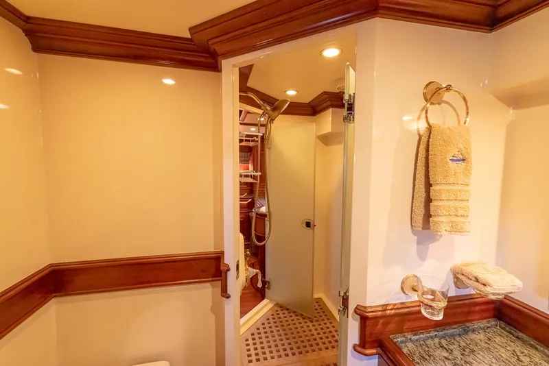 Slide: The Image of Luxurious bathroom interior on 2006 Vicem 85 Classic yacht, featuring elegant wood trim and modern amenities. - 43
