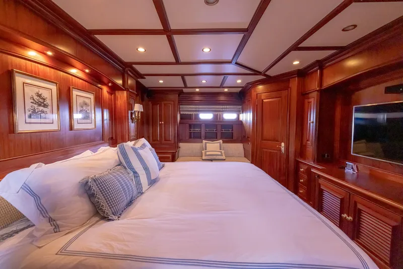 Slide: The Image of Luxurious wood-paneled bedroom in 2006 Vicem 85 Classic yacht with elegant bedding and decor. - 45