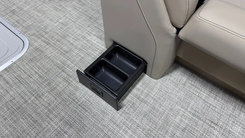Slide: The Image of A pull-out cup holder is integrated into the floor of a Barletta ARIA22UC boat. - 32