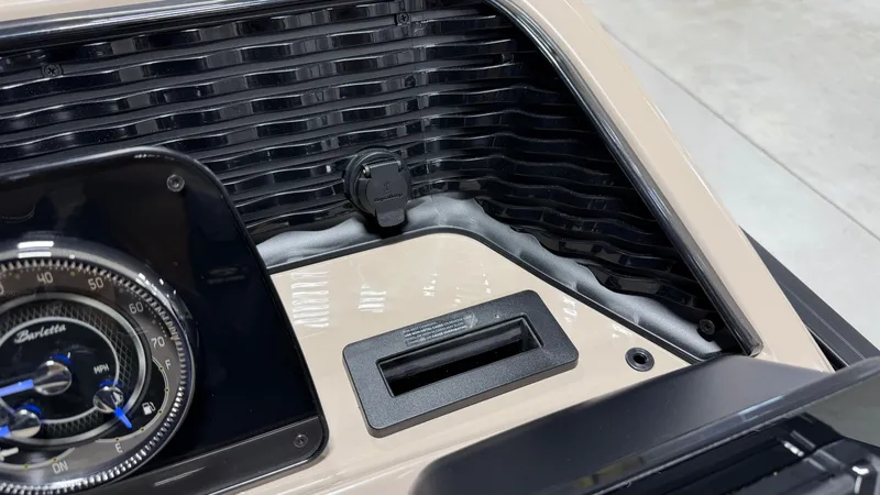 Slide: The Image of Close-up of a boat instrument panel with a Barletta logo and a USB port. - 51