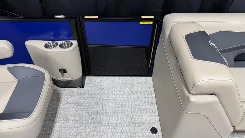 Slide: The Image of Interior of a Barletta ARIA22UC with beige seating and blue accents. - 33
