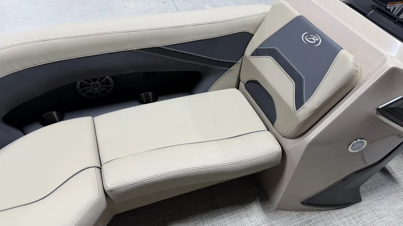 Slide: The Image of The 2027 Barletta ARIA22UC features luxurious cream upholstery with gray accents and a speaker. - 14