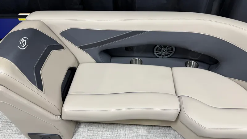 Slide: The Image of The image shows a beige and gray seating area with a speaker and cup holders. - 27