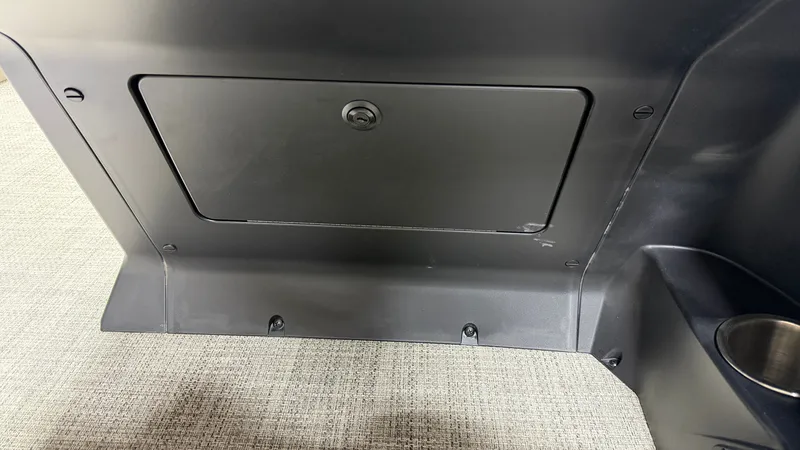 Slide: The Image of A black compartment with a door and lock on a boat. - 47
