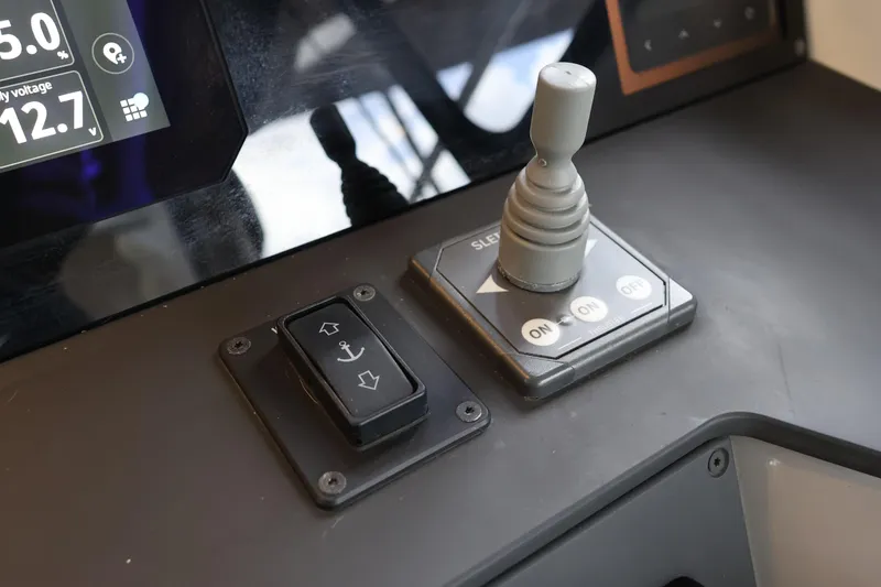 Slide: The Image of Control panel of 2024 Aquador 300 HT boat with joystick and display. - 14