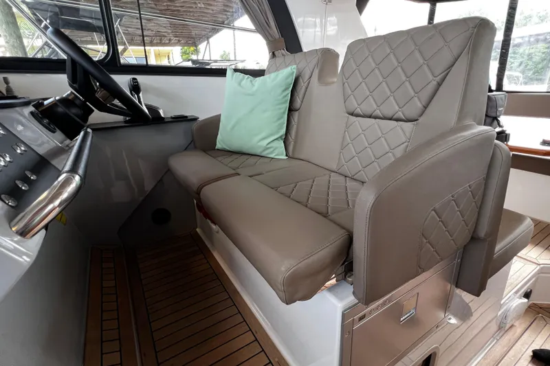 Slide: The Image of Luxurious interior of 2024 Aquador 300 HT boat with quilted leather seating. - 18