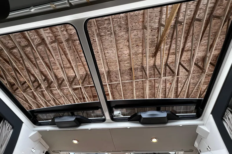 Slide: The Image of 2024 Aquador 300 HT sunroof view showcasing wooden ceiling structure. - 23