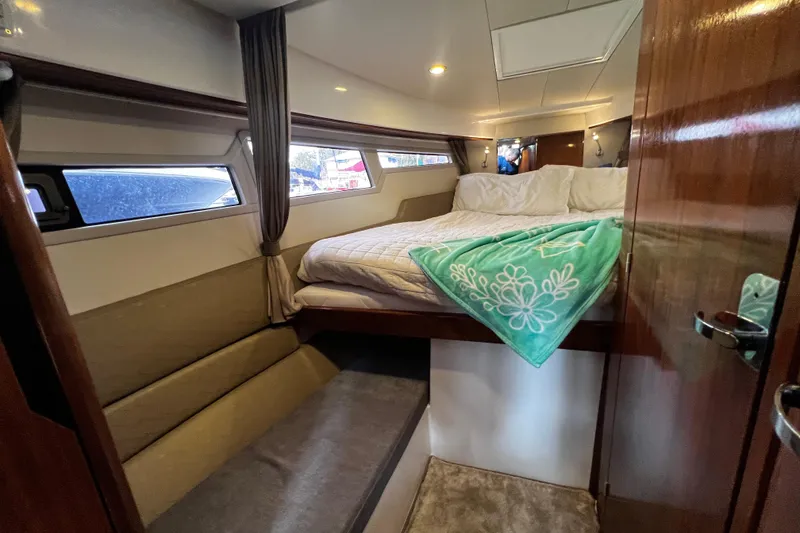 Slide: The Image of Luxurious cabin interior of 2024 Aquador 300 HT boat with cozy bedding and elegant design. - 47