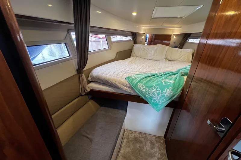 Slide: The Image of Luxurious cabin interior of 2024 Aquador 300 HT yacht with cozy bedding. - 51
