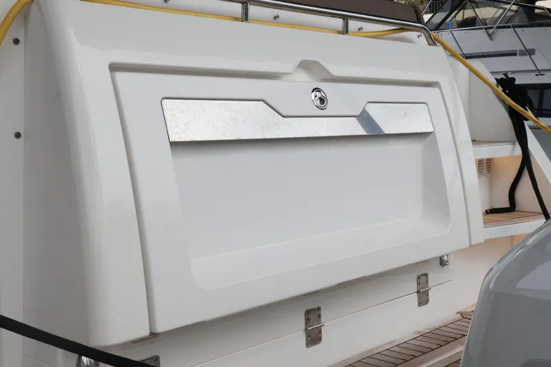 Slide: The Image of 2024 Aquador 300 HT yacht stern with sleek design and modern features. - 63